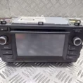 Car stereo head unit with a central touchscreen and labeled media, setup, and car/map controls on a metal diamond plate surface